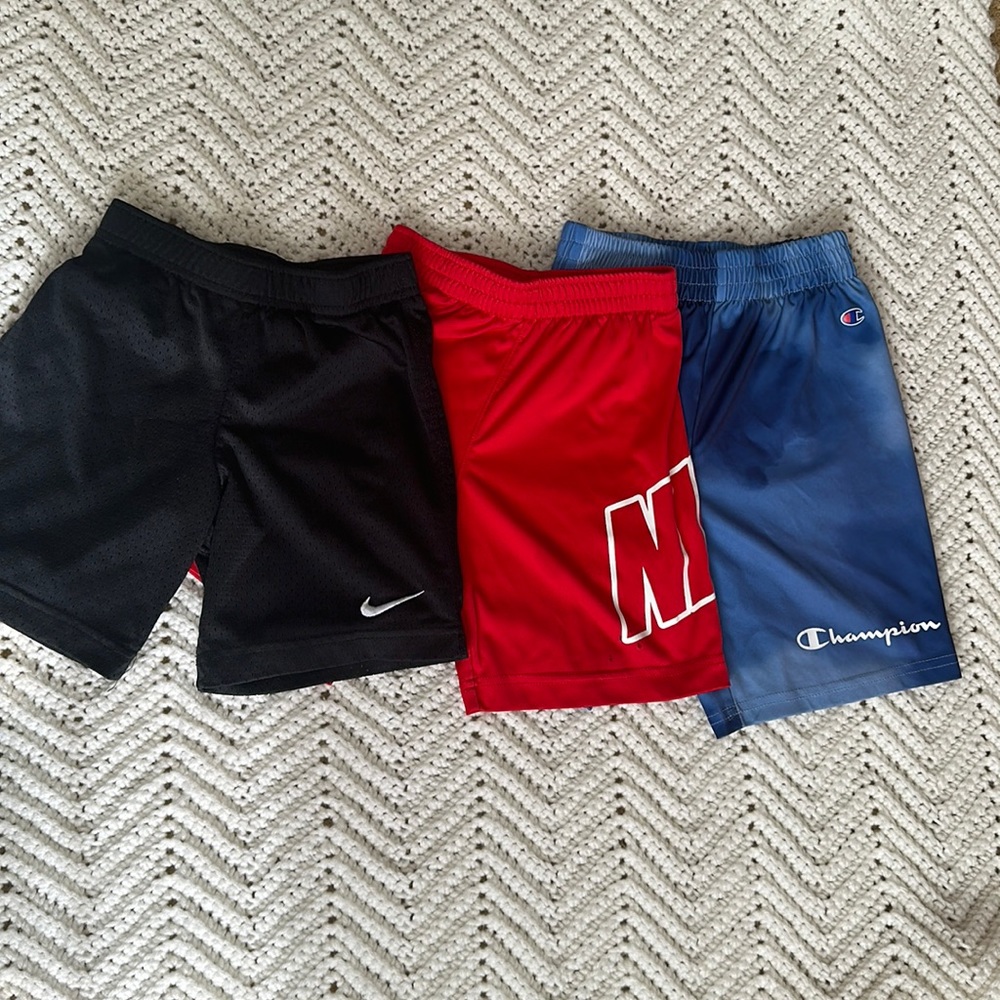 3 pairs of Nike and Champion shorts
